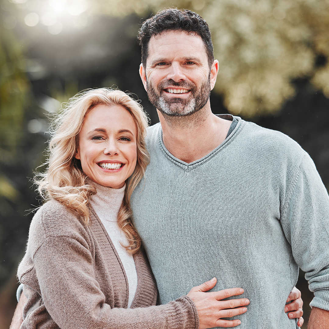 Smiling couple outdoors, representing Legacy Giving and future planning through 6 Stones