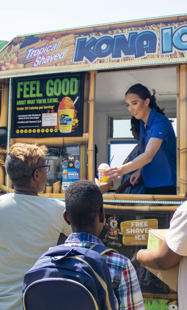 Sponsor, Kona Ice, provides treats to families at Operation Back 2 School.