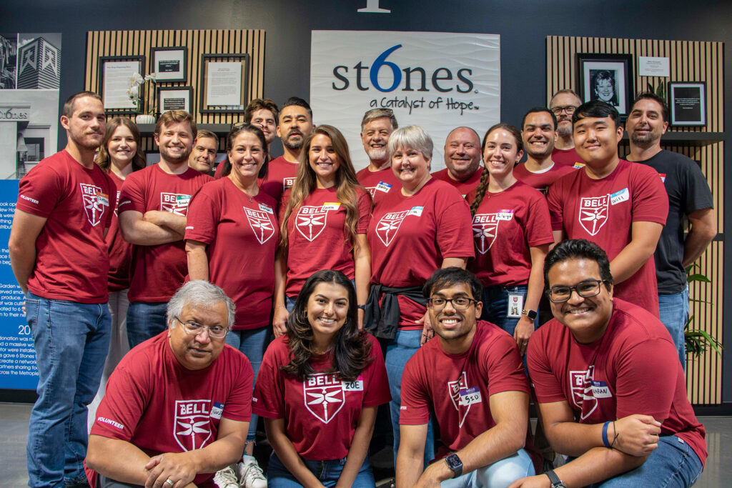 Bell employees volunteering together at 6 Stones to support the local community